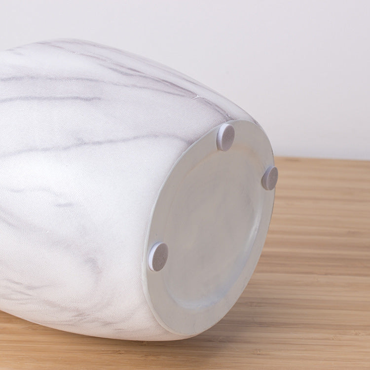 Vase en céramique marbrée blanche