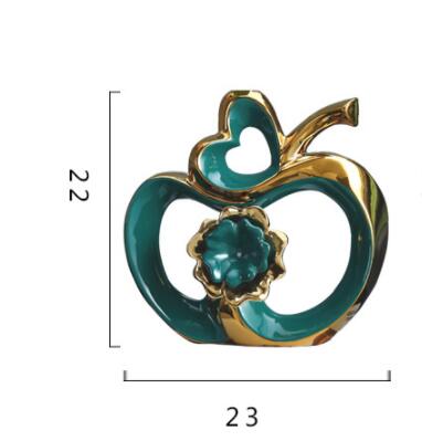 Objet décoratif en céramique avec finition dorée titane, décoration moderne élégante